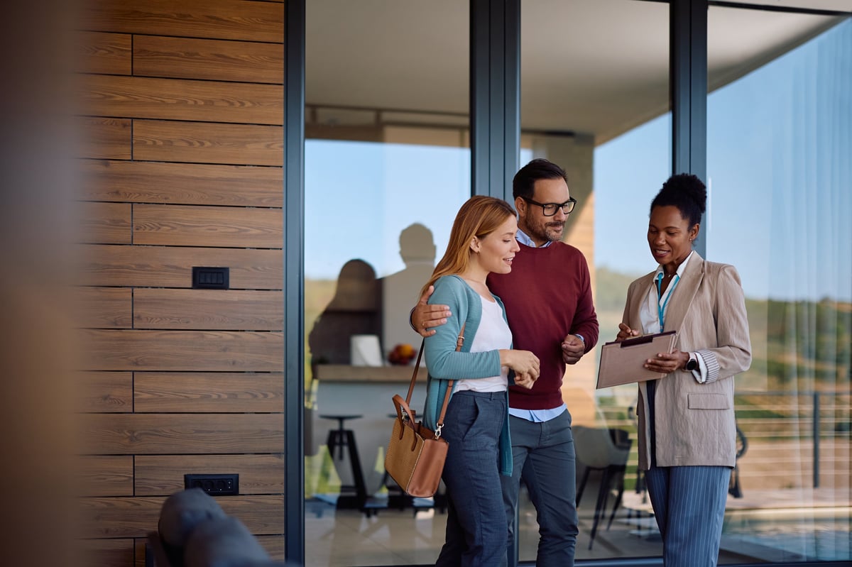 Real estate agent helping clients